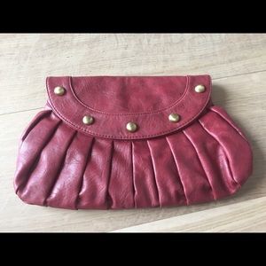 U E cranberry patent leather clutch